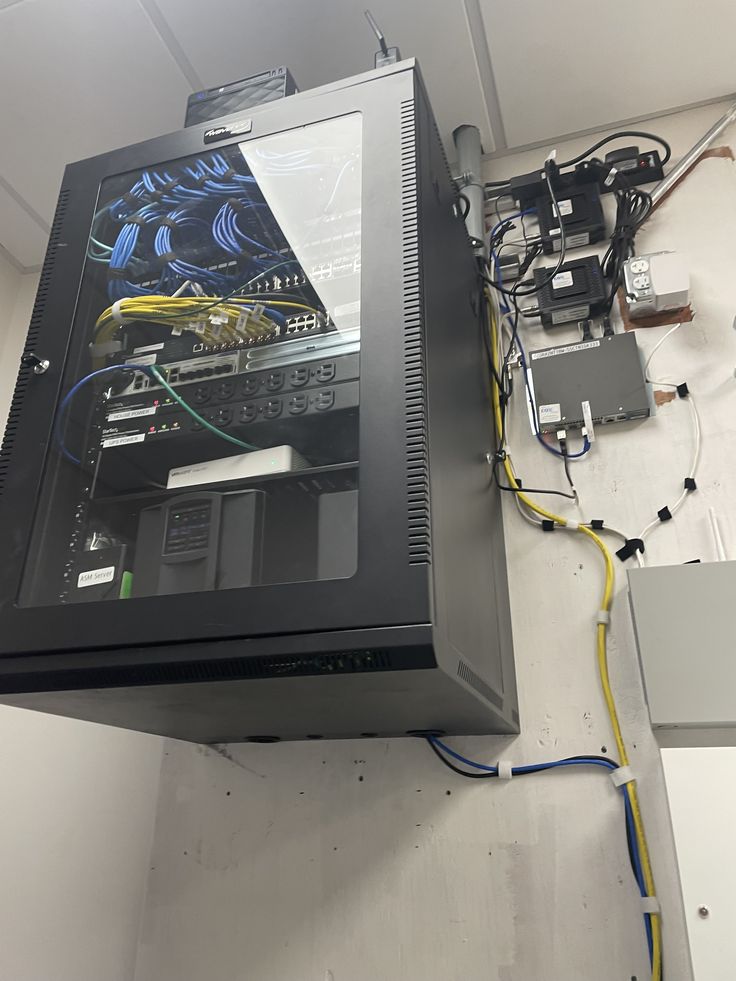 Wall-mounted network cabinet with connected equipment